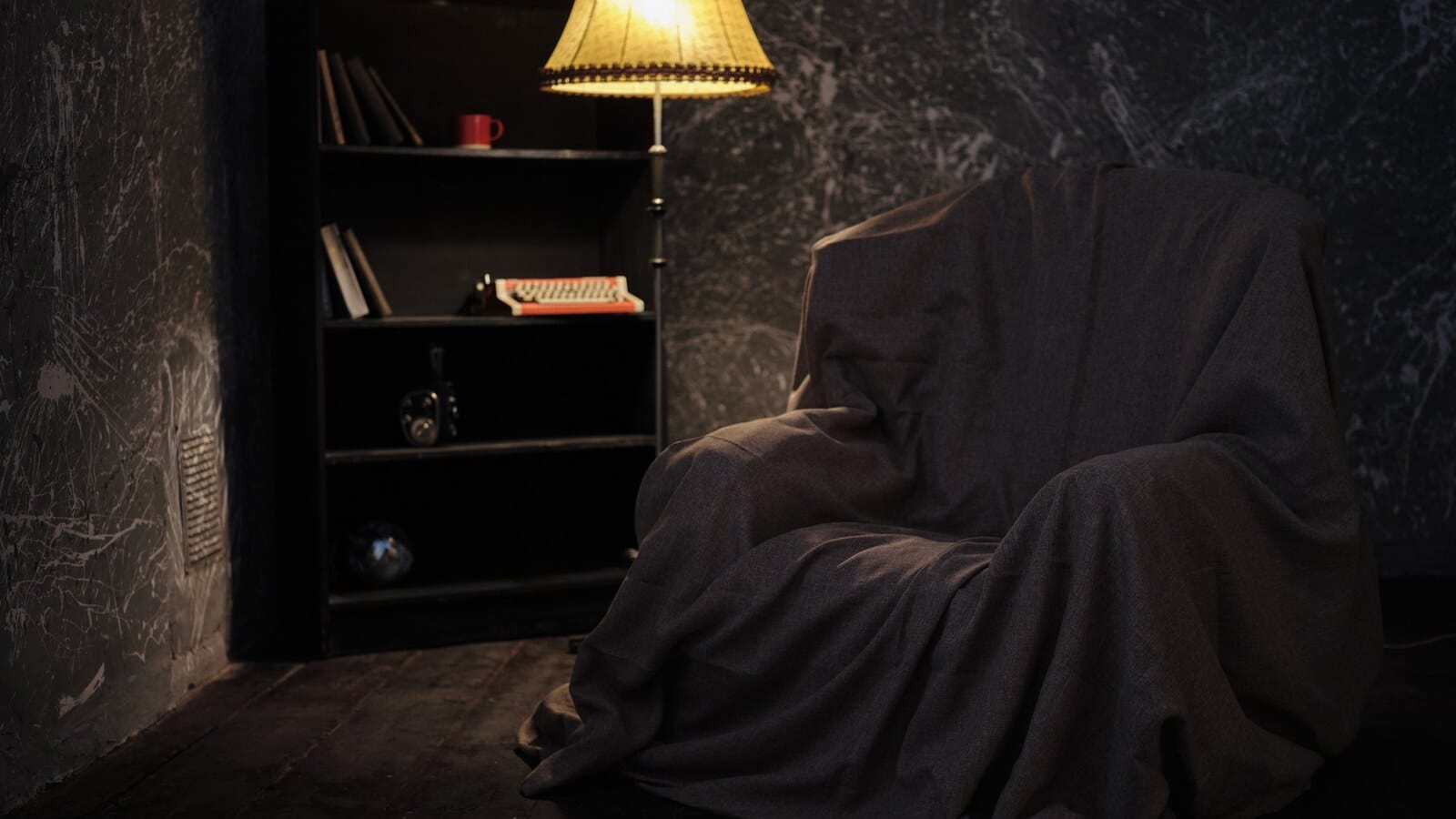 Horizontal dark weekend thriller books scene with moody late night reading atmosphere