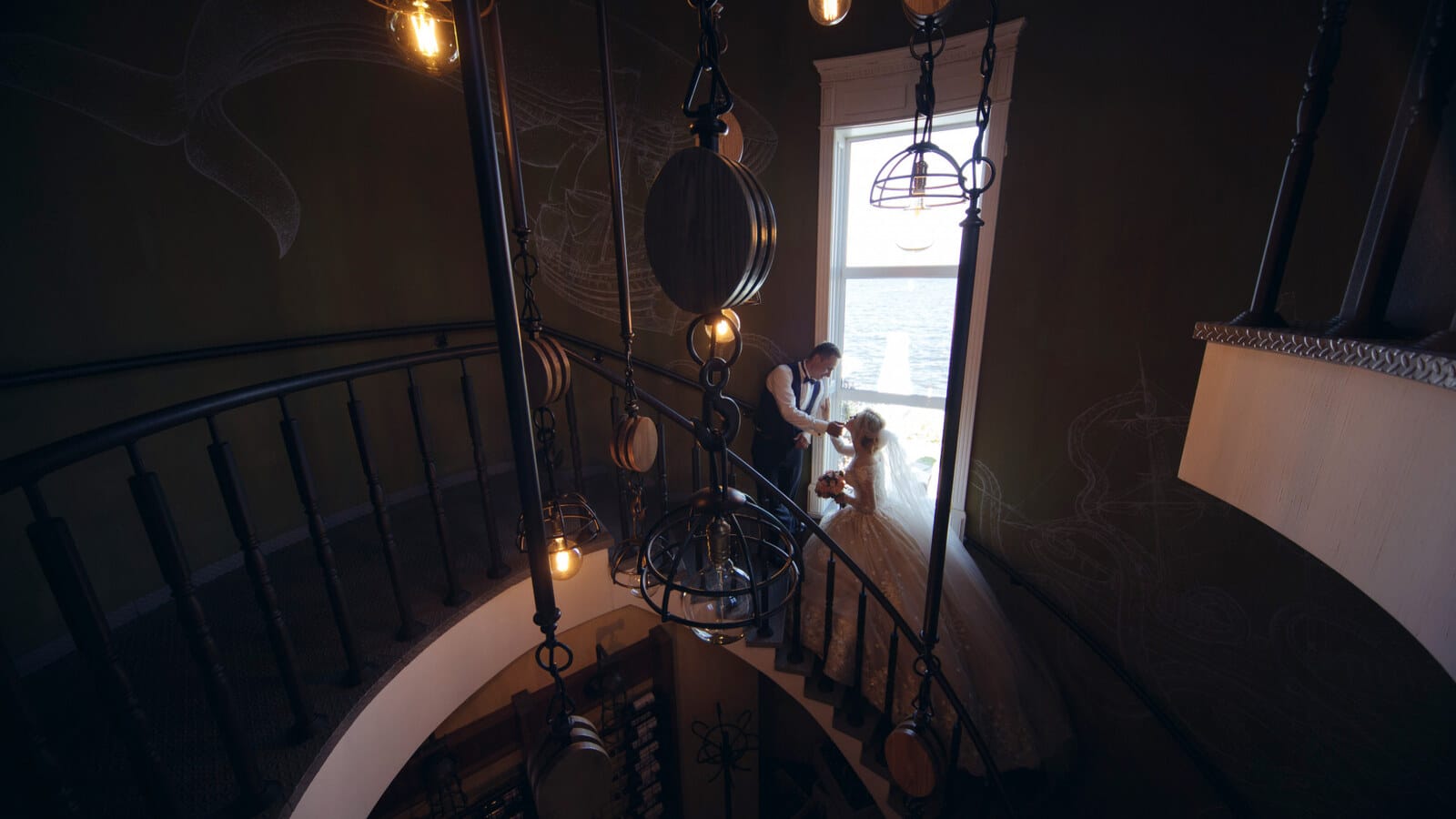 Horizontal moody image of a historic hotel lobby with old chandeliers